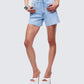 Women's blue cotton shorts styled on model – FINESSE