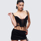 Women's black corset top styled on model – FINESSE