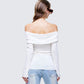 Women's white top close-up detail – FINESSE
