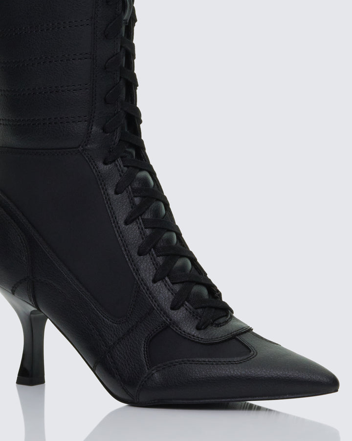 Women's black boots close-up detail – FINESSE