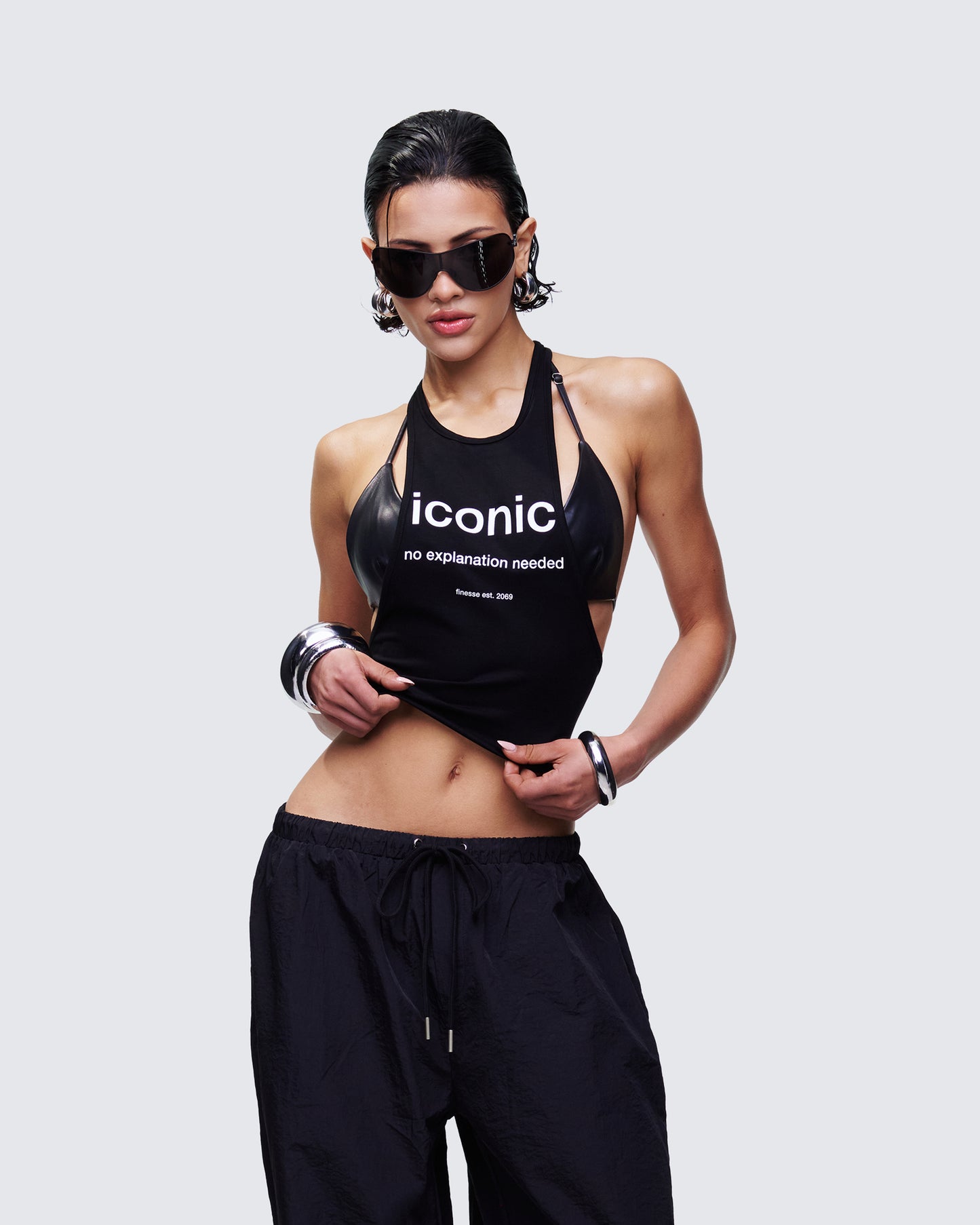 Women's black tank top styled on model – FINESSE