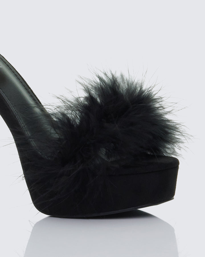 Women's black heels close-up detail – FINESSE