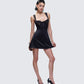 Women's black mini dress close-up detail – FINESSE