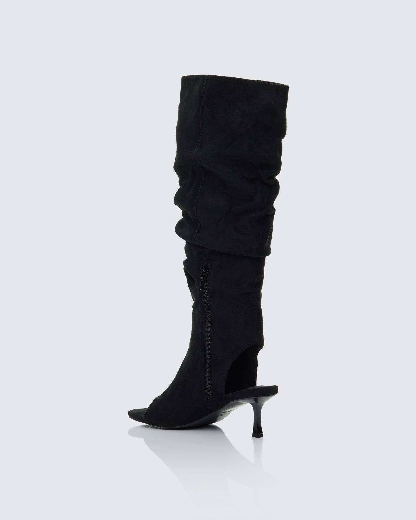 Women's black boots styled on model – FINESSE