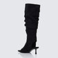 Women's black boots styled on model – FINESSE